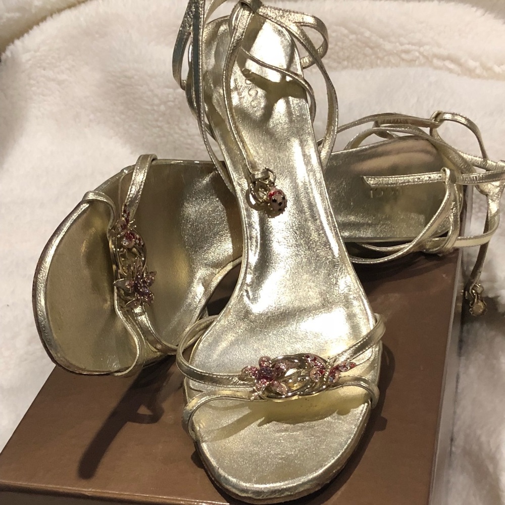 Authentic Gucci Gold strap sandals.